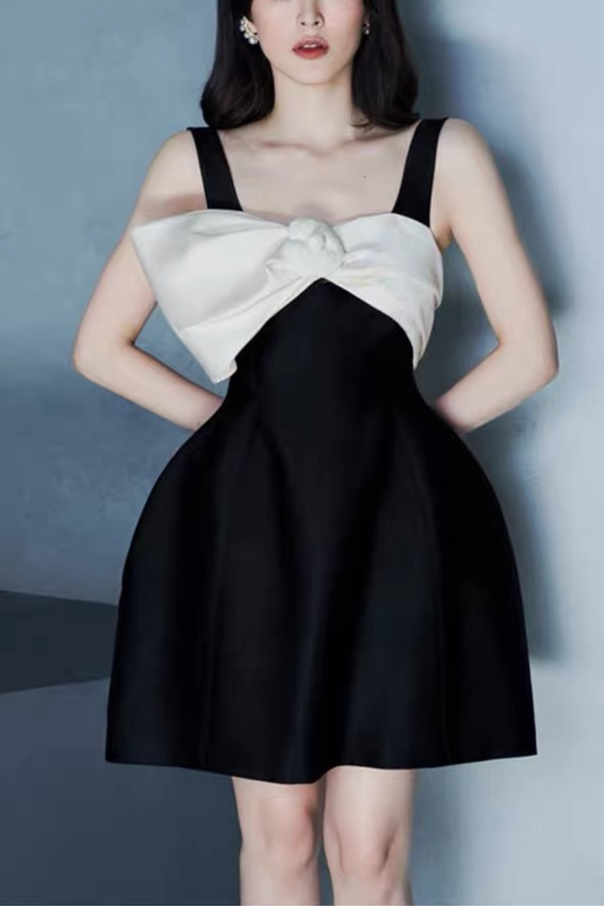 Black Sleeveless Mini Dress with Statement and Structured Skirt