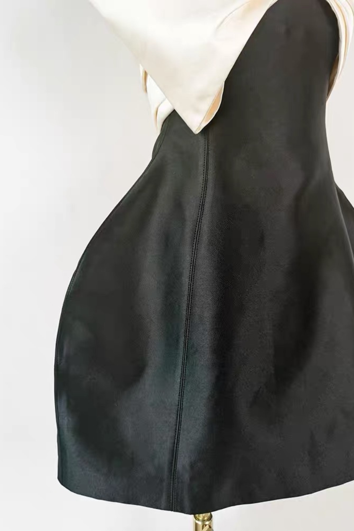 Black Sleeveless Mini Dress with Statement and Structured Skirt